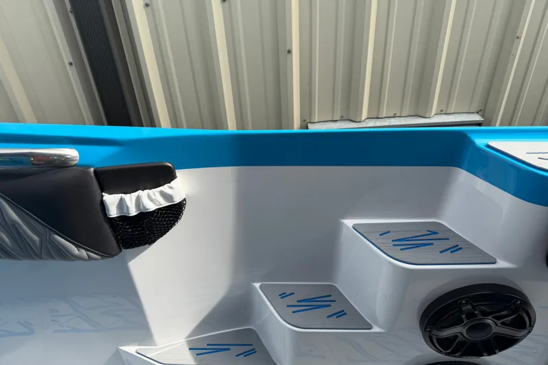 Slide: The Image of Interior of a 2027 Nor-Tech boat featuring blue accents and modern design elements. - 31