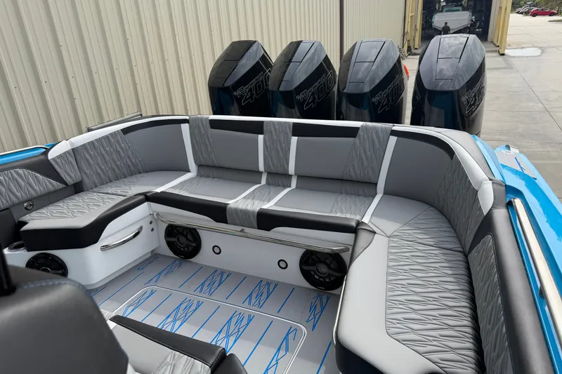 Slide: The Image of Luxurious 2027 Nor-Tech boat interior with sleek seating and powerful outboard engines. - 15