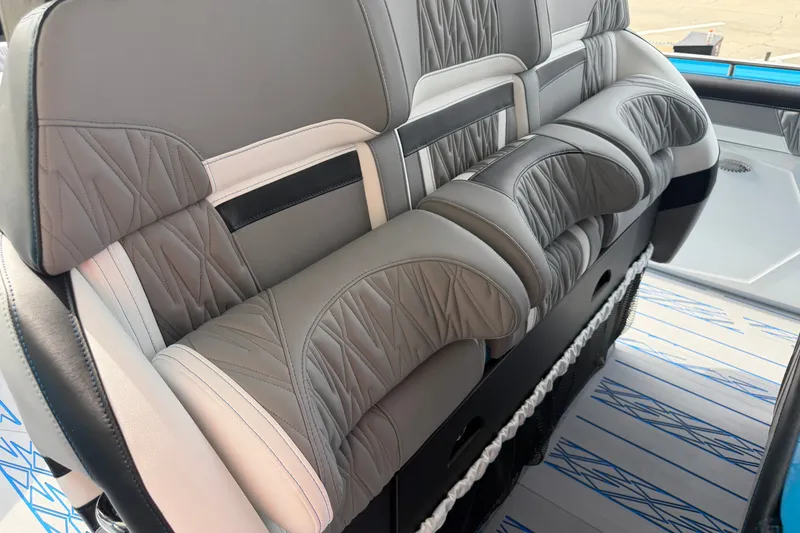 Slide: The Image of Luxurious seating on a 2027 Nor-Tech boat, featuring elegant gray and black upholstery. - 34