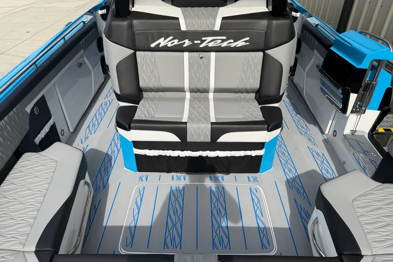 Slide: The Image of 2027 Nor-Tech boat interior with stylish seating and modern design elements. - 22