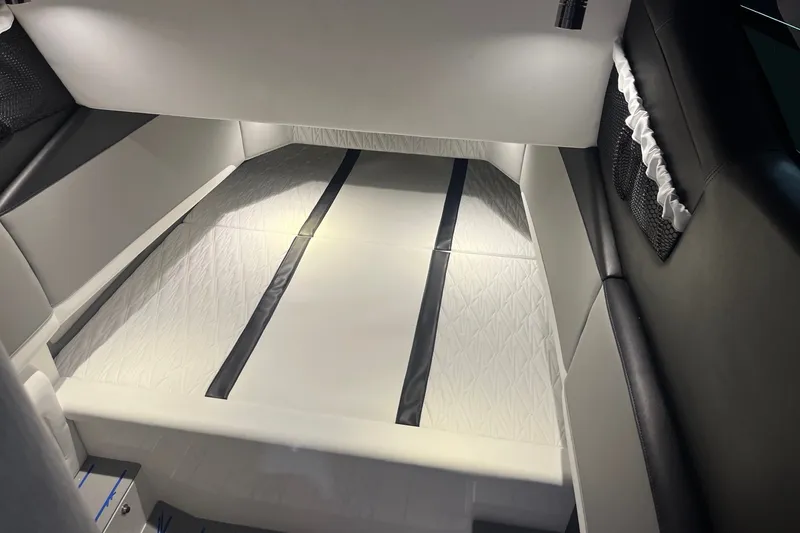 Slide: The Image of Luxurious interior of a 2027 Nor-Tech boat, featuring sleek white and black seating. - 40