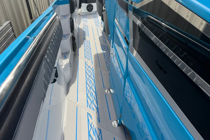 Slide: The Image of Interior view of a 2027 Nor-Tech boat with sleek blue and gray design. - 30