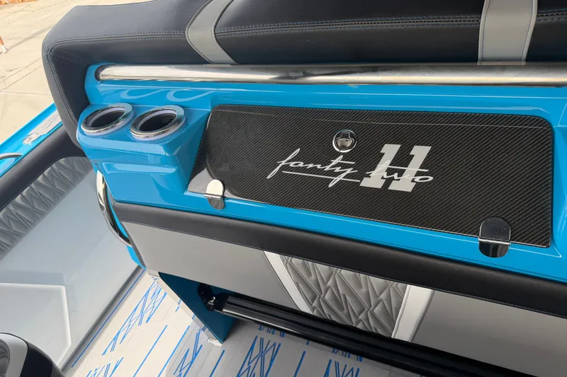 Slide: The Image of 2027 Nor-Tech boat interior with blue accents and custom "forty two" design. - 35