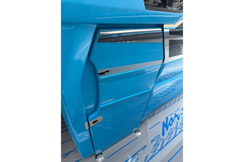 Slide: The Image of Blue 2027 Nor-Tech boat interior with sleek design and metallic accents. - 33