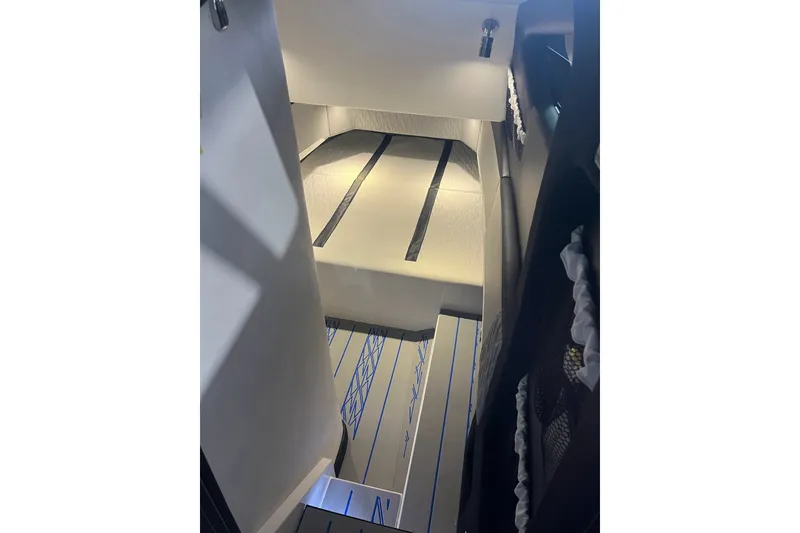 Slide: The Image of Interior view of 2027 Nor-Tech boat cabin with modern design and lighting. - 39