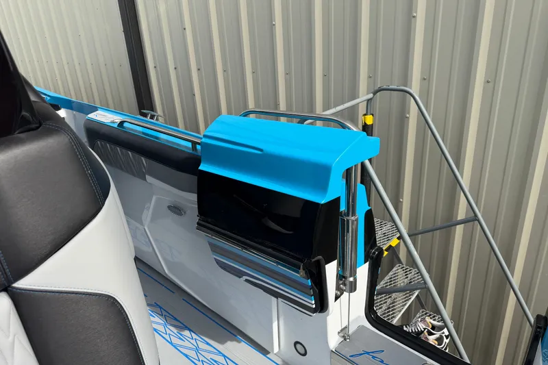 Slide: The Image of Nor-Tech 2027 boat interior with blue accents and sleek design elements. - 18