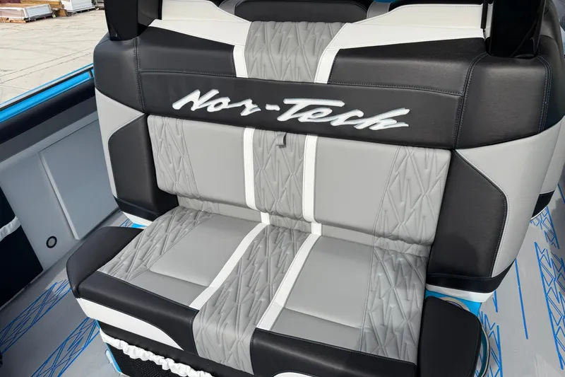 Slide: The Image of 2027 Nor-Tech boat seat with stylish gray and black upholstery design. - 16