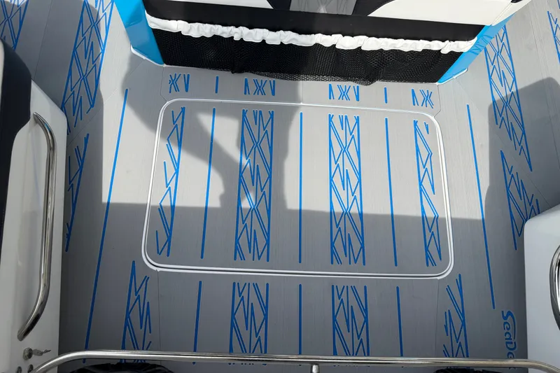 Slide: The Image of Nor-Tech 2027 boat deck with blue patterned SeaDek flooring. - 23