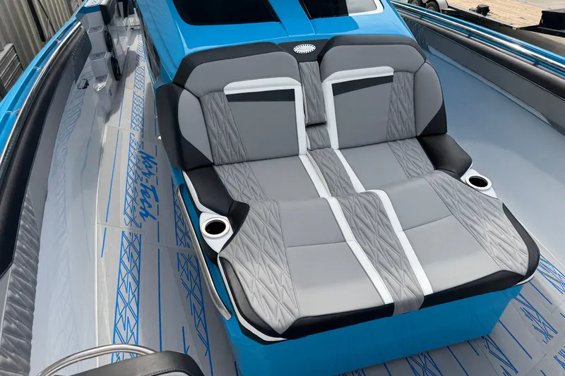 Slide: The Image of Luxurious seating on a 2027 Nor-Tech boat, featuring sleek gray and blue design. - 29