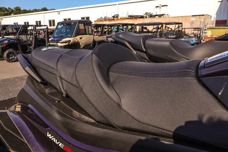 Slide: The Image of 2026 Yamaha WaveRunner GP HO jet ski with sleek black seating, parked outdoors. - 14