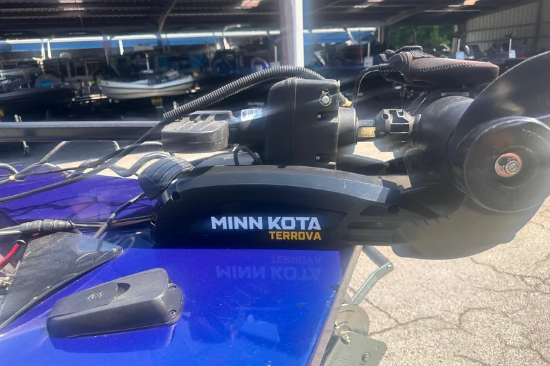 Slide: The Image of Minn Kota Terrova motor on 2023 G3 Sportsman 1710 boat, parked in a marina. - 5