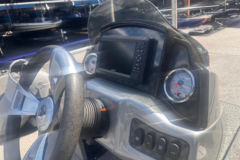 Slide: The Image of 2023 G3 Sportsman 1710 dashboard with steering wheel, gauges, and Garmin display. - 3