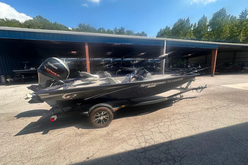 Slide: The Image of 2023 G3 Sportsman 1710 boat with Yamaha engine in outdoor storage area. - 7