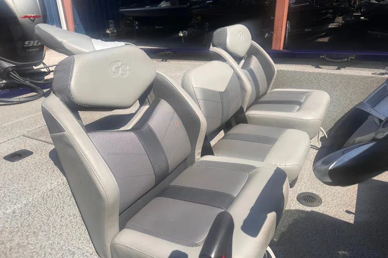 Slide: The Image of 2023 G3 Sportsman 1710 boat seats, gray upholstery, Yamaha engine visible in background. - 4