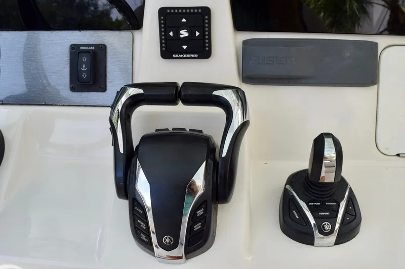 Slide: The Image of Control panel of 2023 Sailfish 312 CC boat with throttle and joystick. - 20
