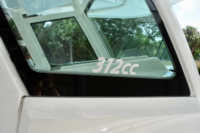 Slide: The Image of 2023 Sailfish 312 CC boat window with model number displayed. - 19