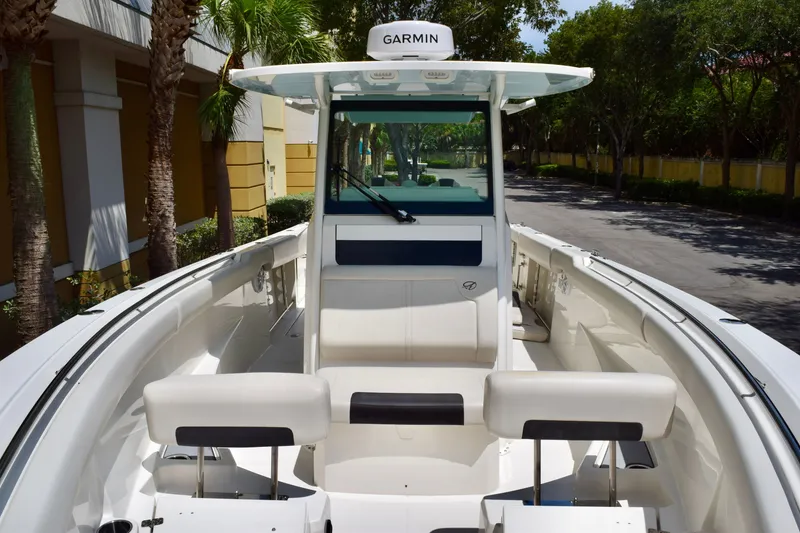 Slide: The Image of 2023 Sailfish 312 CC boat interior with Garmin navigation system. - 18