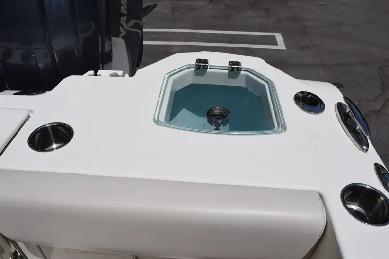 Slide: The Image of 2023 Sailfish 312 CC boat with livewell and cup holders on deck. - 22