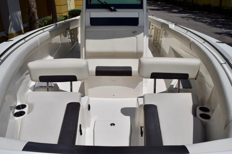 Slide: The Image of 2023 Sailfish 312 CC boat interior with white seating and cup holders. - 17
