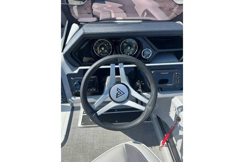 Slide: The Image of Steering wheel and dashboard of 2026 Viaggio Lago X-U 24 boat. - 12