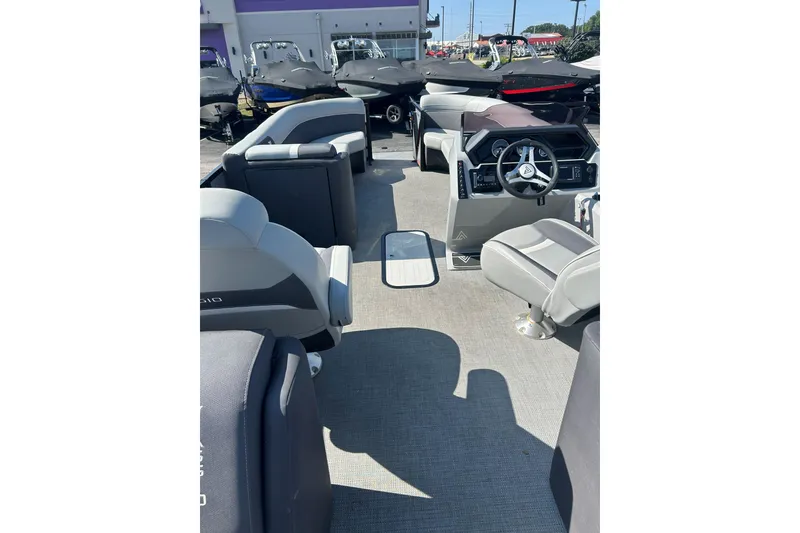 Slide: The Image of Interior view of 2026 Viaggio Lago X-U 24 pontoon boat with modern seating and steering console. - 6
