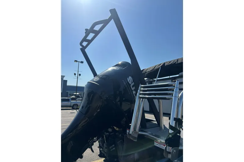 Slide: The Image of 2026 Viaggio Lago X-U 24 boat with Suzuki outboard motor in a sunny parking lot. - 20