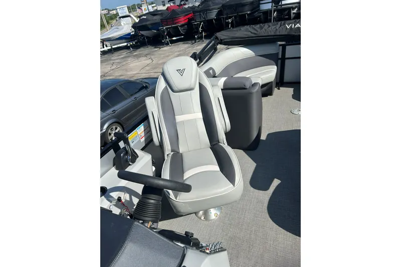 Slide: The Image of Captain's chair on 2026 Viaggio Lago X-U 24 boat, featuring sleek design and modern controls. - 16