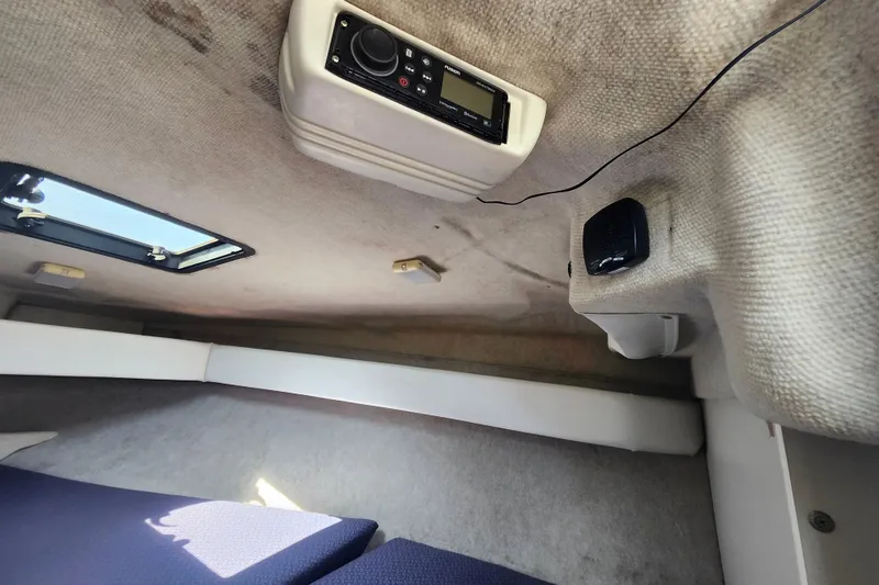 Slide: The Image of Interior of 2017 Bayliner 210 Cuddy cabin with radio and speaker system. - 20