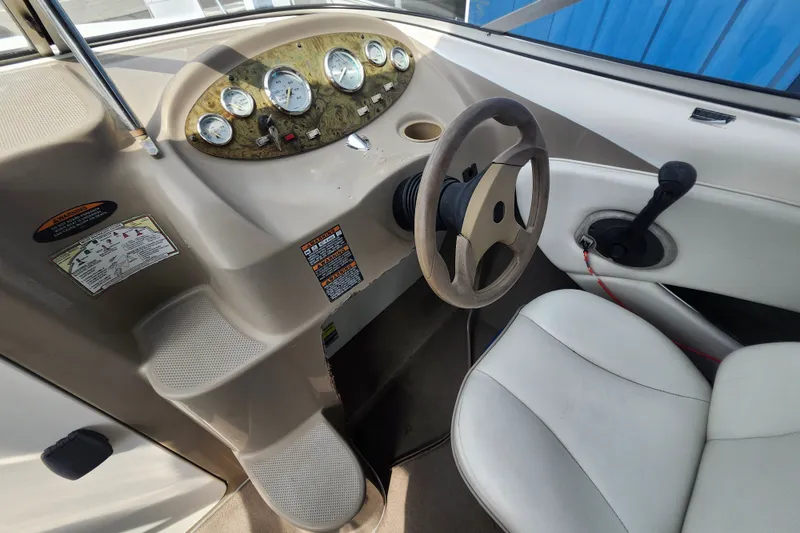 Slide: The Image of 2017 Bayliner 210 Cuddy boat cockpit with steering wheel and instrument panel. - 15