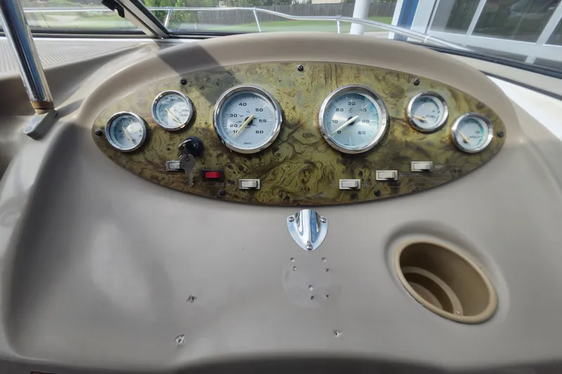 Slide: The Image of Dashboard of a 2017 Bayliner 210 Cuddy boat with gauges and controls. - 16
