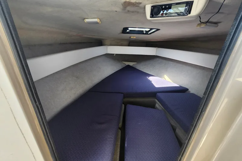 Slide: The Image of Interior cabin of 2017 Bayliner 210 Cuddy boat with cushioned seating. - 18
