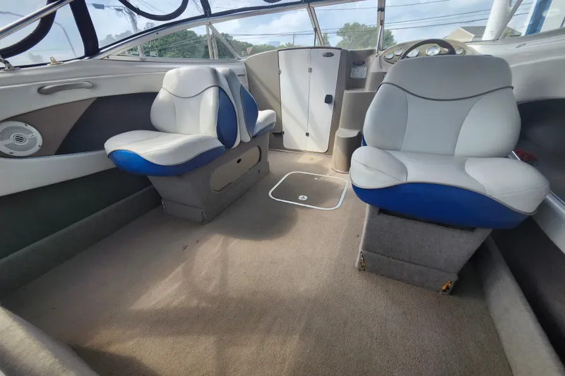 Slide: The Image of Interior of a 2017 Bayliner 210 Cuddy boat with plush seating and modern design. - 8