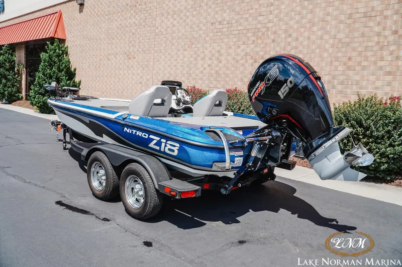 Slide: The Image of 2025 Nitro Z18 Pro boat with powerful engine, parked at Lake Norman Marina. - 2