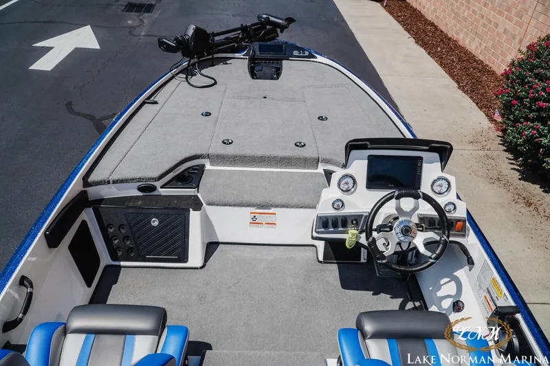Slide: The Image of 2025 Nitro Z18 Pro boat interior with steering wheel and control panel at Lake Norman Marina. - 7