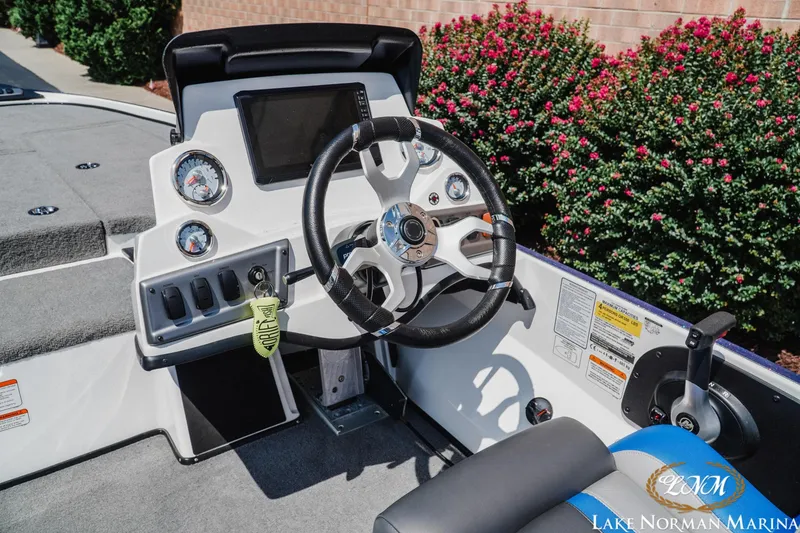 Slide: The Image of Steering console of 2025 Nitro Z18 Pro boat with gauges and controls. - 9