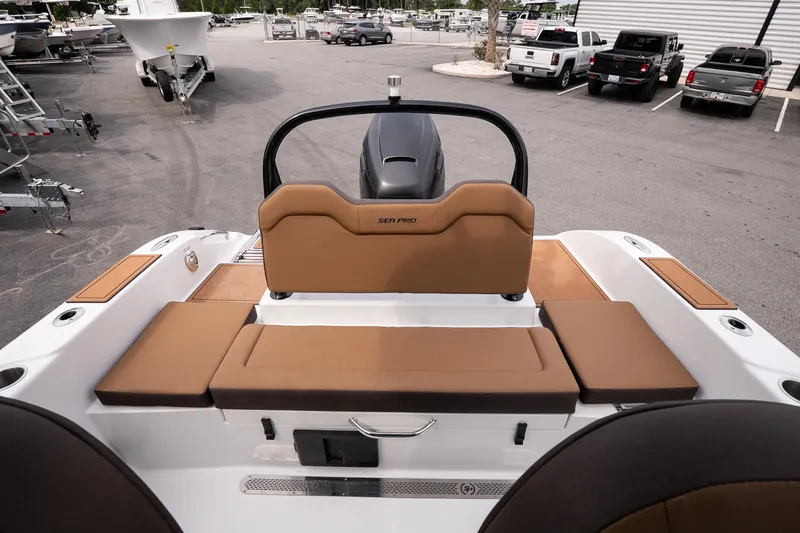 Slide: The Image of 2027 Sea Pro 245FLXR Sandbar boat interior with tan seating and modern design. - 14