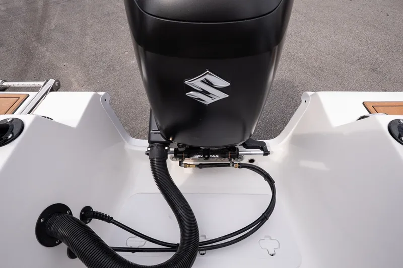 Slide: The Image of Rear view of 2027 Sea Pro 245FLXR Sandbar boat engine and deck details. - 16