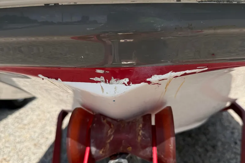 Slide: The Image of 2014 Hurricane SunDeck Sport 188 OB boat with visible hull damage and scratches. - 15