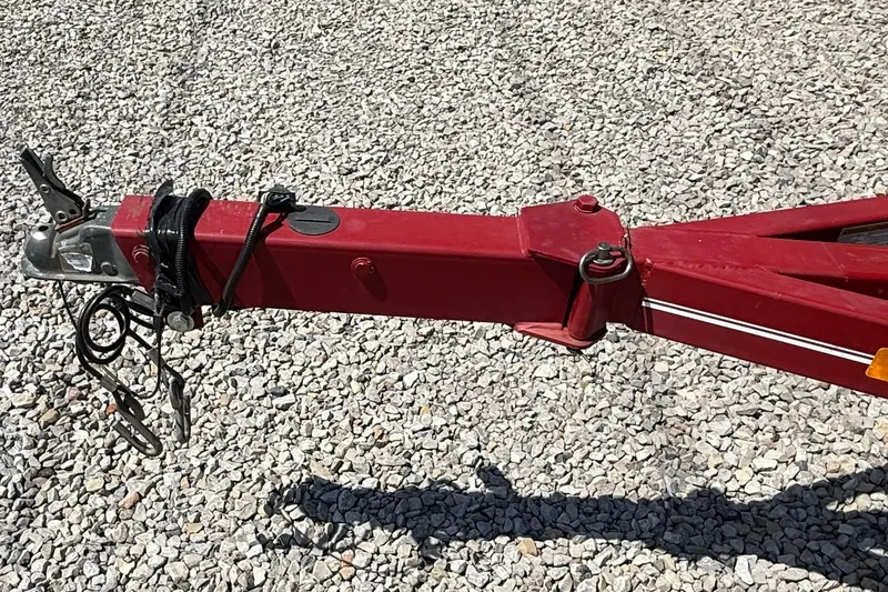 Slide: The Image of Red trailer hitch on gravel, compatible with 2014 Hurricane SunDeck Sport 188 OB. - 14
