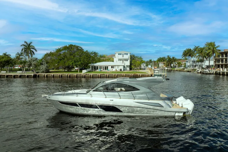 Slide: The Image of Luxury Valiatt 410HT yacht cruising on a scenic waterway, 2025 model. - 21