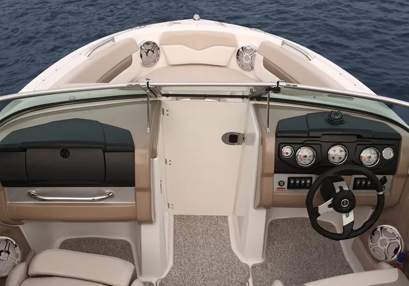 Slide: The Image of Manufacturer Provided Image: 2012 Chaparral 196 SSi boat interior with dashboard and seating, on open water. - 24