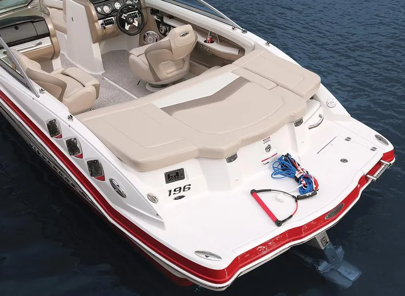 Slide: The Image of Manufacturer Provided Image: 2012 Chaparral 196 SSi boat with beige seating and red accents on water. - 26