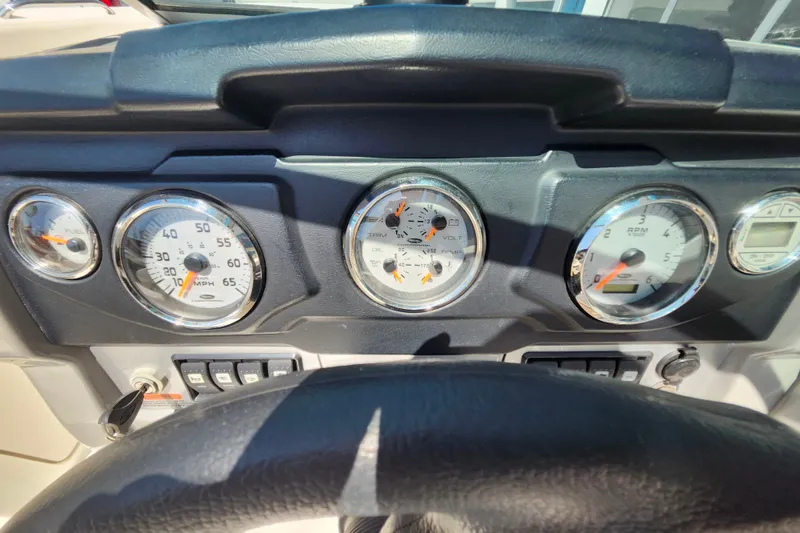 Slide: The Image of Dashboard of a 2012 Chaparral 196 SSi boat with gauges and controls. - 9