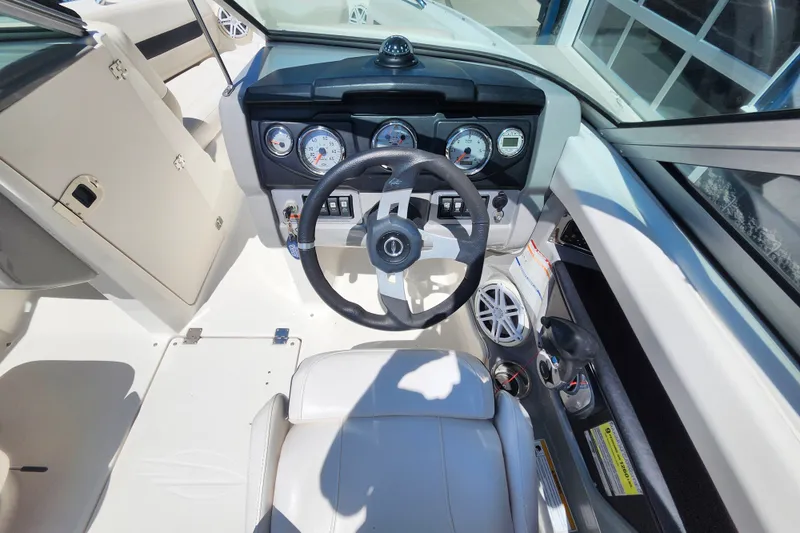 Slide: The Image of Interior view of 2012 Chaparral 196 SSi boat dashboard and steering wheel. - 10