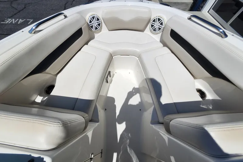 Slide: The Image of Interior view of 2012 Chaparral 196 SSi boat with white cushioned seating. - 13