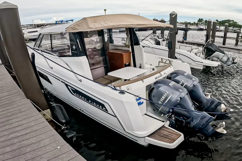 Slide: The Image of 2016 Jeanneau Merry Fisher 855 docked with twin Yamaha engines. - 7