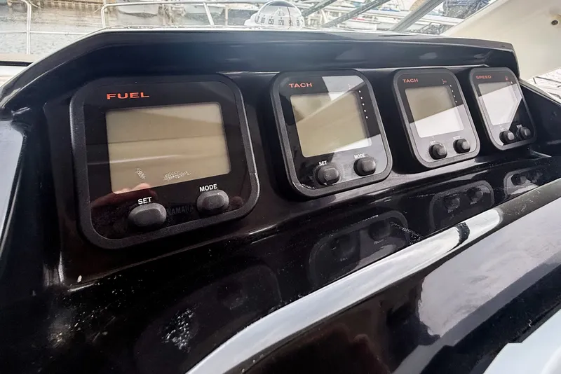 Slide: The Image of Control panel of a 2016 Jeanneau Merry Fisher 855 boat, featuring fuel and tachometer gauges. - 22