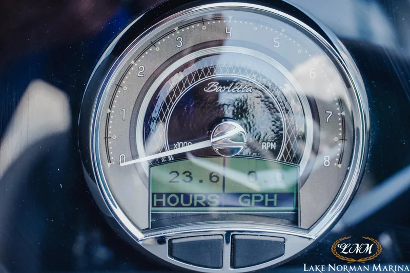 Slide: The Image of Close-up of 2023 Barletta L550 gauge displaying RPM and hours at Lake Norman Marina. - 17