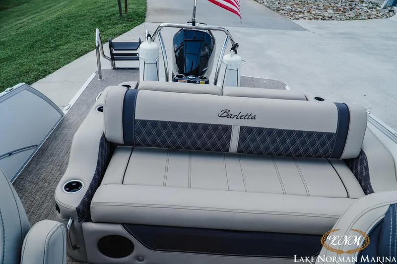 Slide: The Image of 2023 Barletta L550 boat interior with plush seating at Lake Norman Marina. - 16