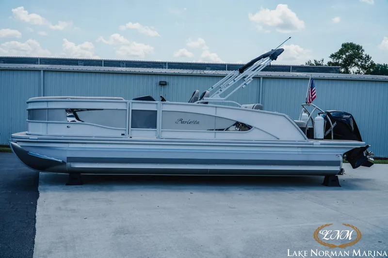 The Image of 2023 Barletta L550 pontoon boat at Lake Norman Marina, side view. - 1